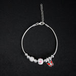Pulsera tipo pd en plata ley 925 con dijes esferas mariposas rojas y rosas, y diamantados