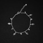 Pulsera delgada con dijes de ojos y circones en plata ley 925