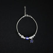 Pulsera tipo pd en plata ley 925 con dijes esferas azules y diamantados y estrella