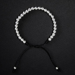 Pulsera en hilo terlenka con cuentas bolitas de plata ley 925