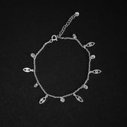 Pulsera delgada con dijes de ojos y circones en plata ley 925 